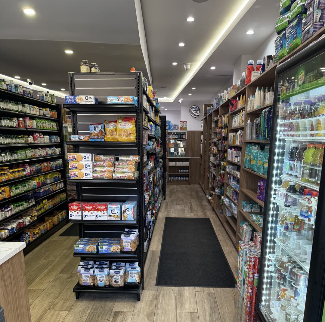 pharmacist greeting a patient inside Park West Pharmacy